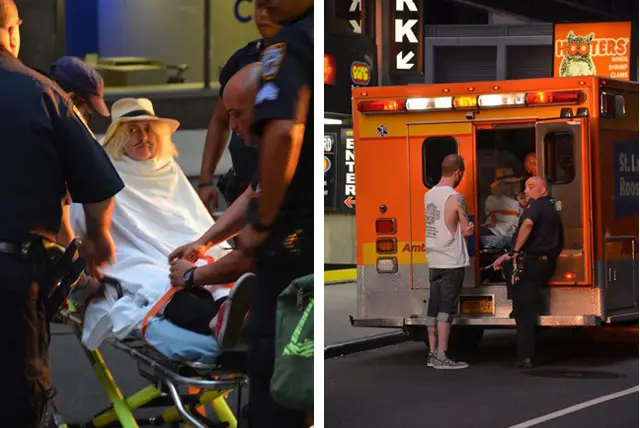 Holly Van Voast being taken away in an ambulance after her going topless in front of HOOTERS
